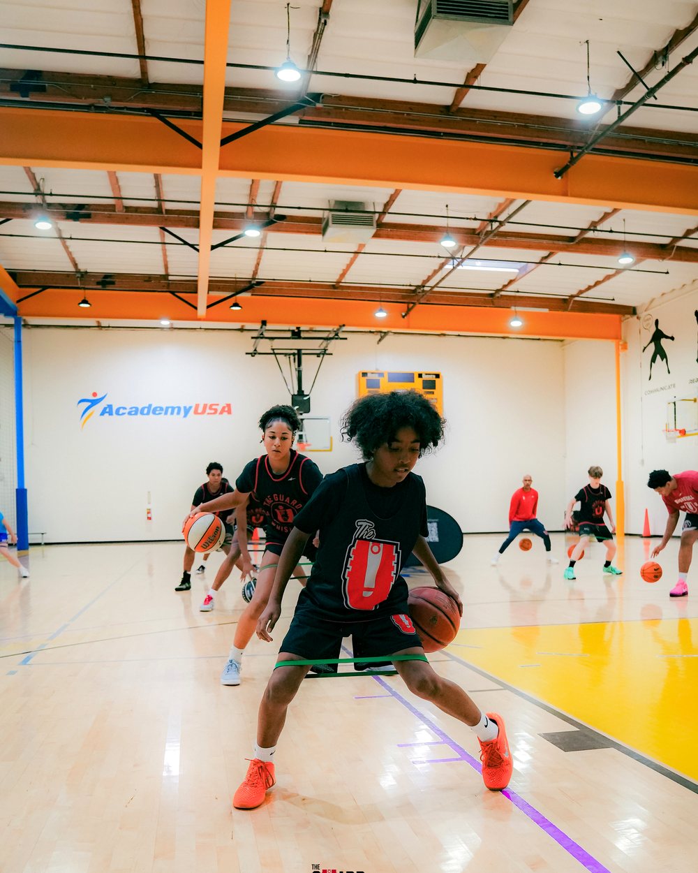 The U athlete in a resistance-band dribble drill